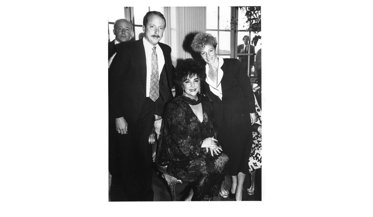 Elizabeth Taylor with CEO Tim Wolfred and Carole Midgen 