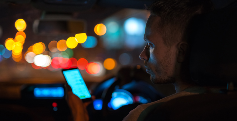 man on phone in car