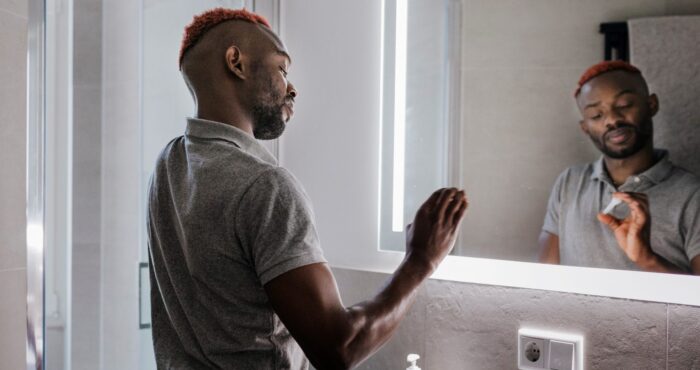Person in bathroom doing home test