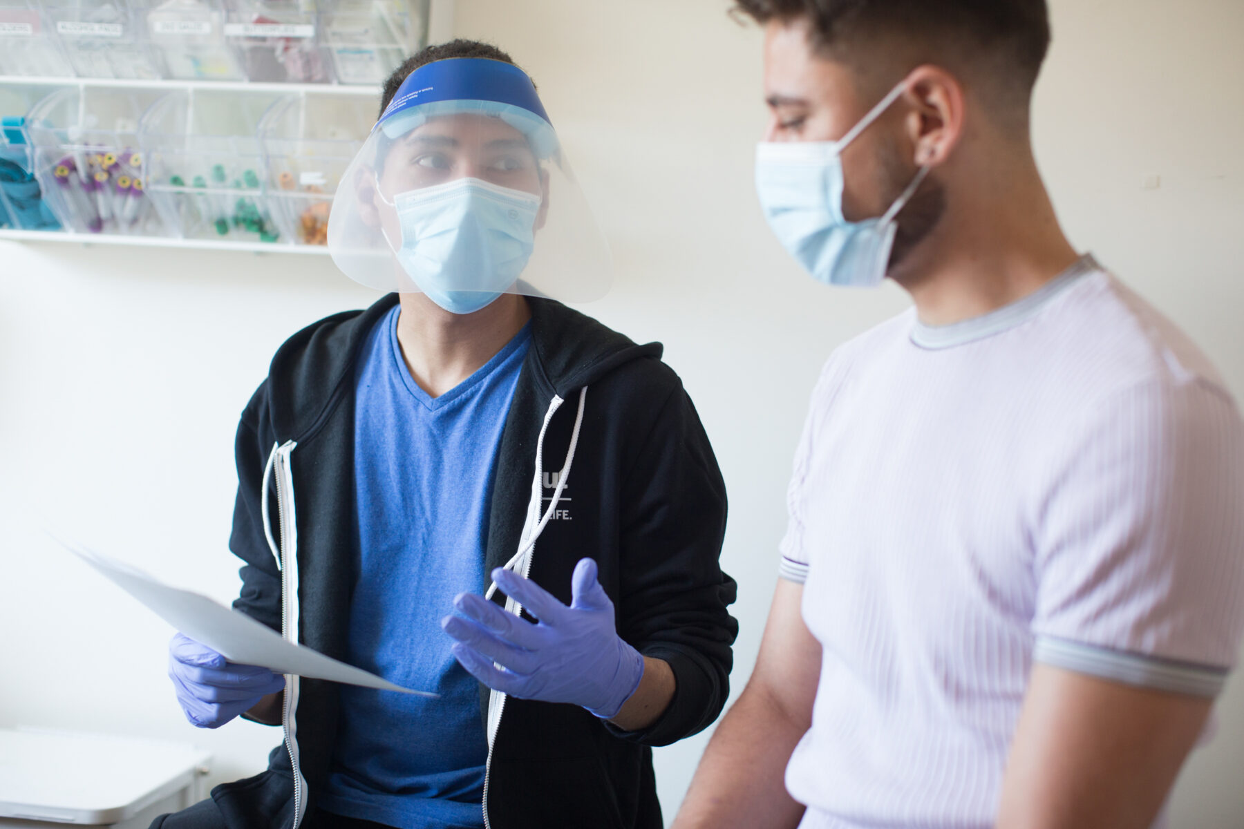 Person receiving health care wearing mask