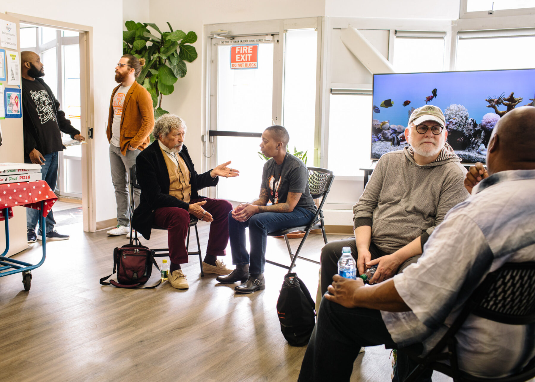 People sitting in a room talking in pairs